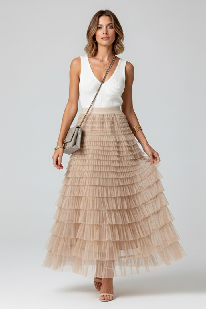 Women's black layered tulle midi skirt featuring a flattering elastic waist, perfect for summer fashion.