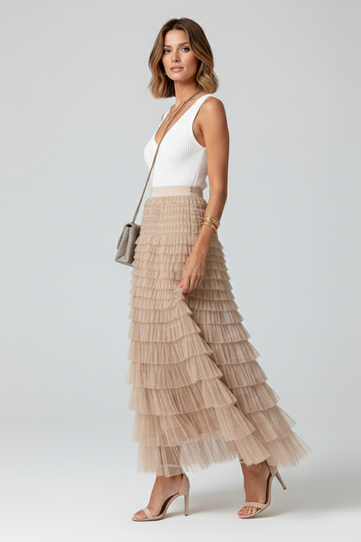Fashionable black women's layered tulle midi skirt, designed with an elastic waist for comfort and elegance.