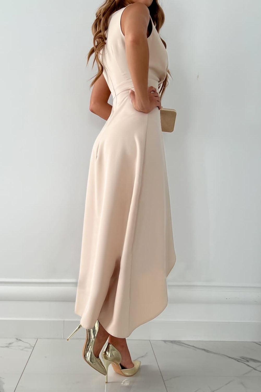 Women's chic V-neck wrap maxi dress in flowing beige fabric, ideal for summer.