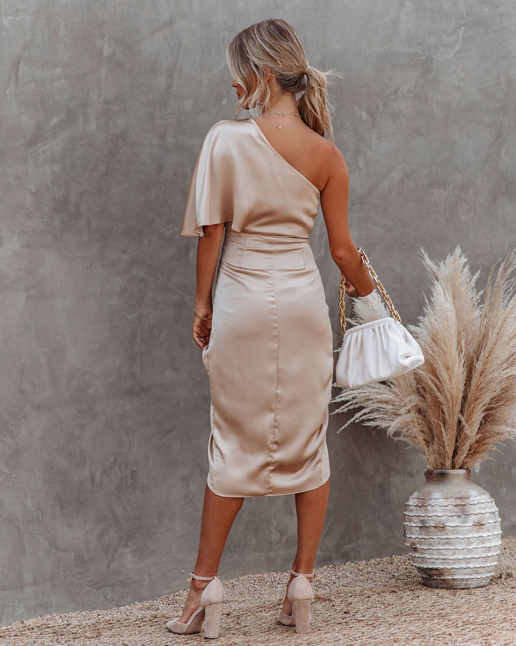 Sophisticated women's beige ruched midi dress with an asymmetric one-shoulder neckline, perfect for evening wear.