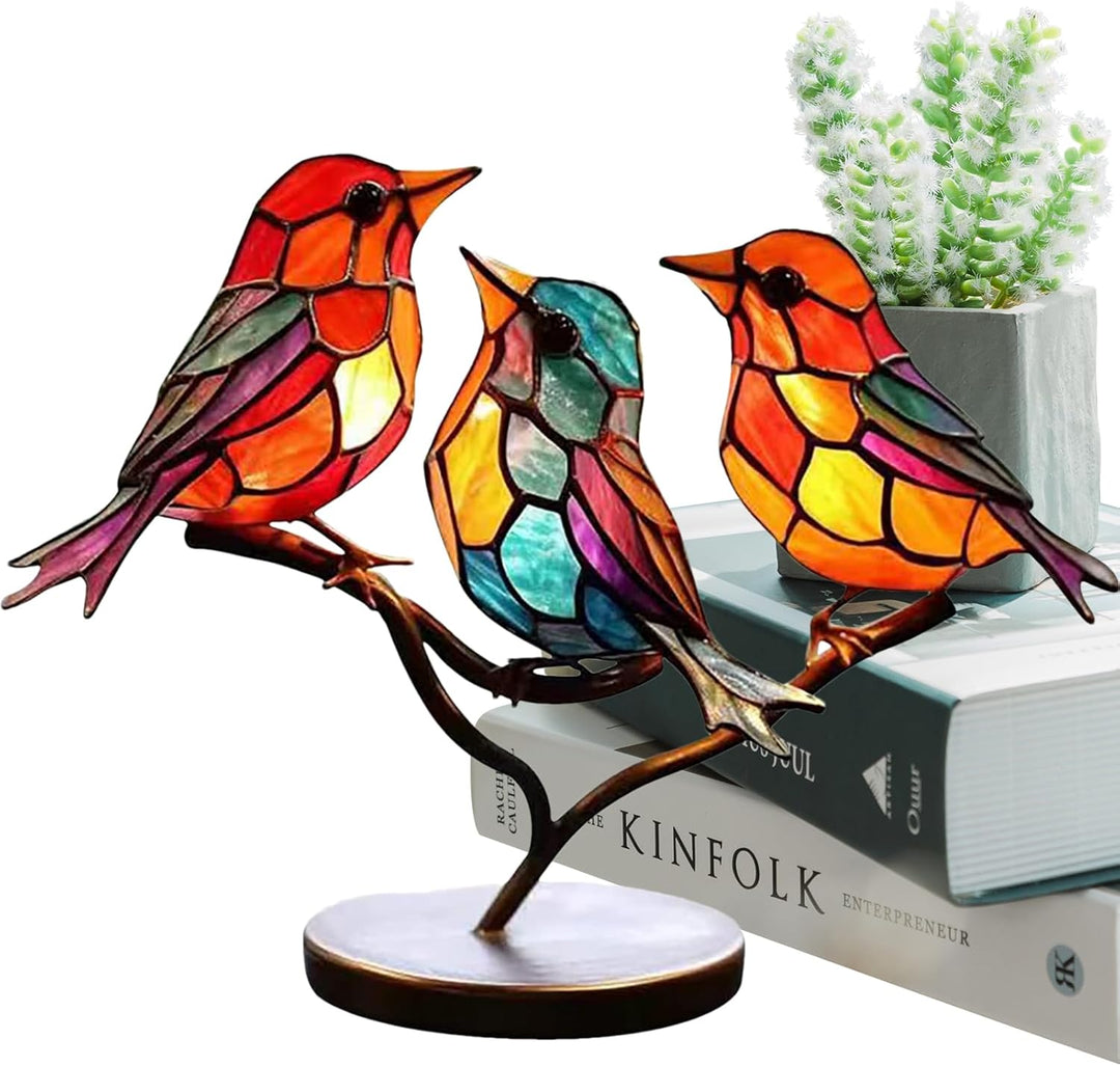 Distinctive bird sculpture with artistic colored glass design, modern tabletop accent.
