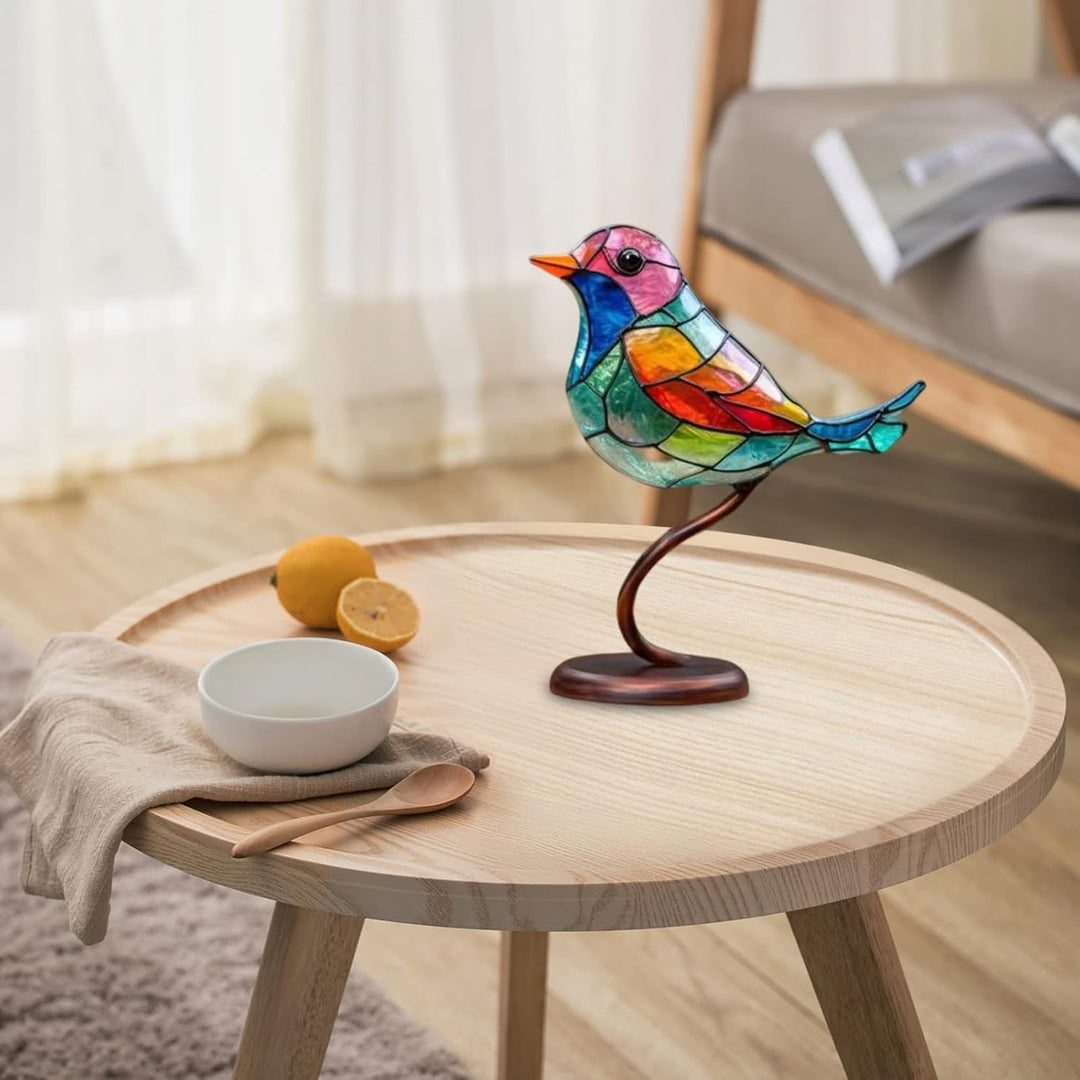 Living room decor: elegant bird sculpture, artistic colored glass tabletop art, modern style.