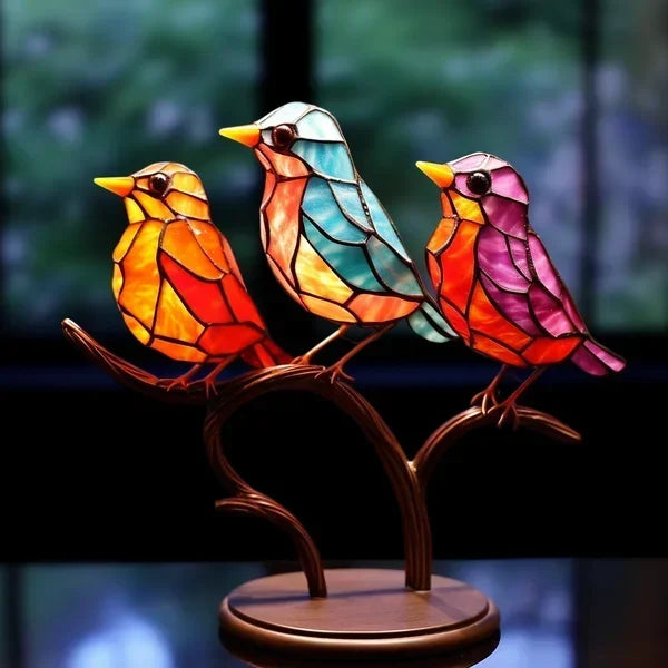 Artistic bird sculpture with intricate colored glass design, unique tabletop decor.