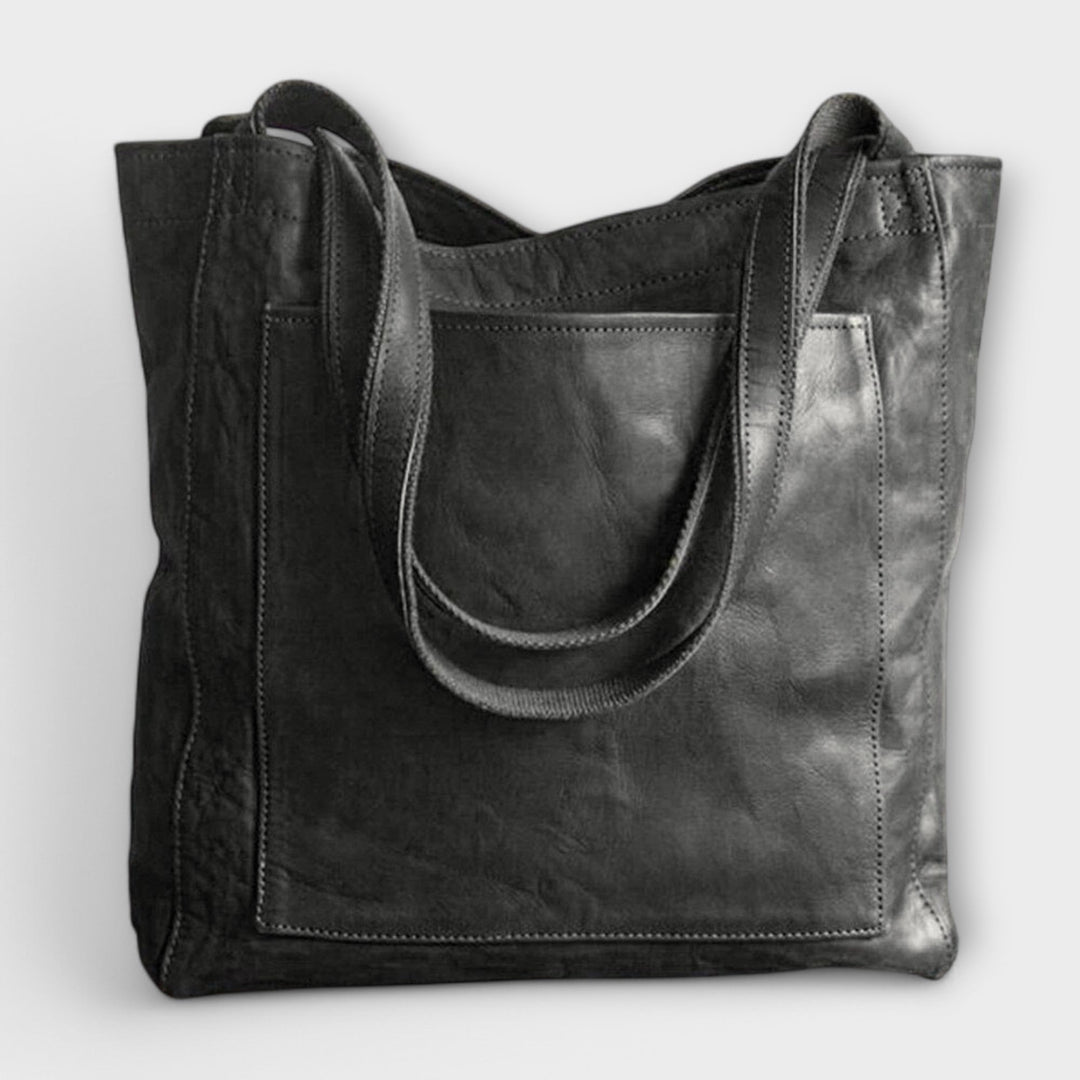 Durable faux leather tote bag for women, offering style and functionality as a shoulder bag