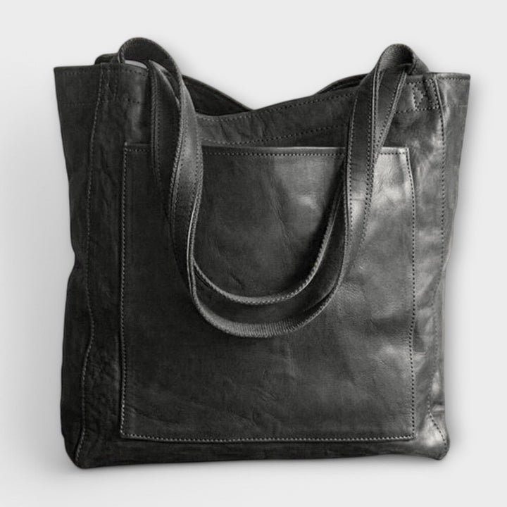 Durable faux leather tote bag for women, offering style and functionality as a shoulder bag