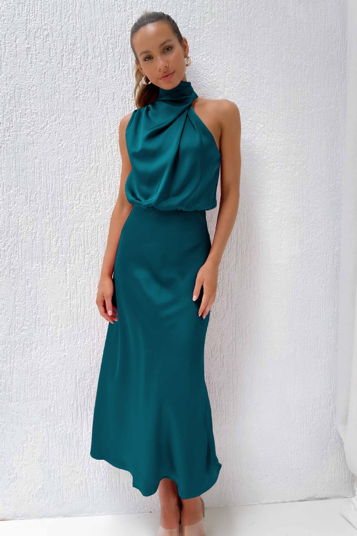 Beautiful women's halter neck evening dress, showcasing a graceful long design