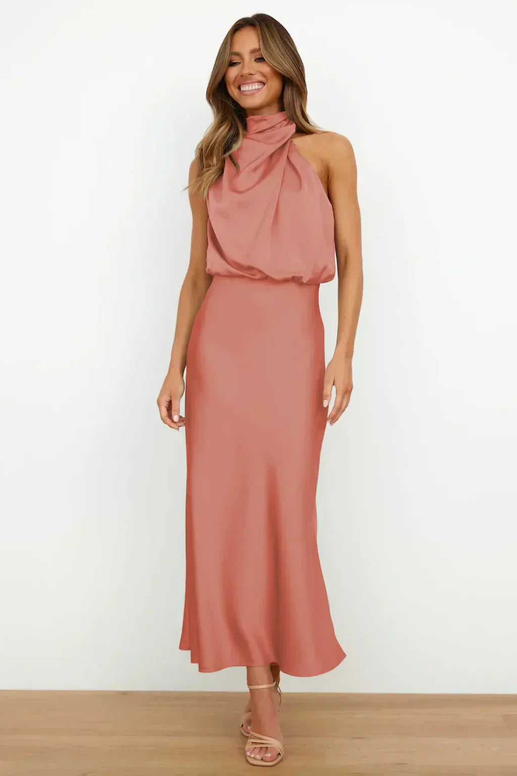 Fashionable women's halter neck evening gown with a flowing silhouette
