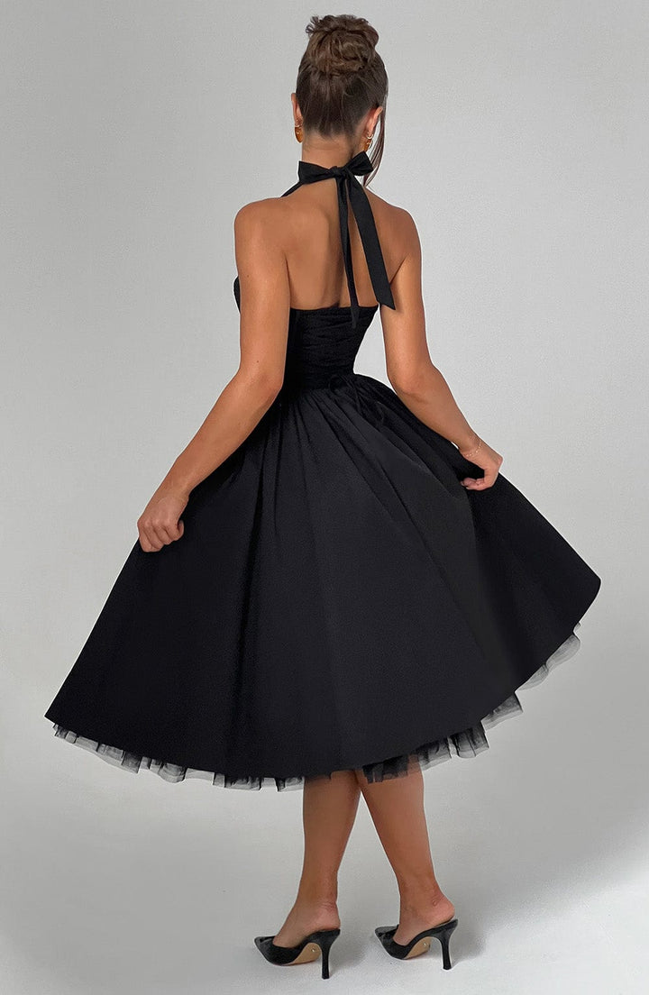 Sophisticated black women's dress, halter neck and midi length, for formal occasions.