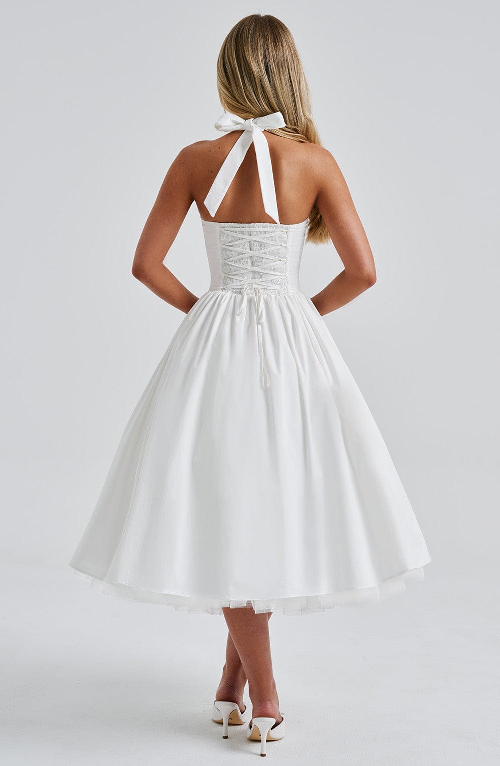 Stylish black cocktail midi dress, suitable for evening events and formal gatherings.