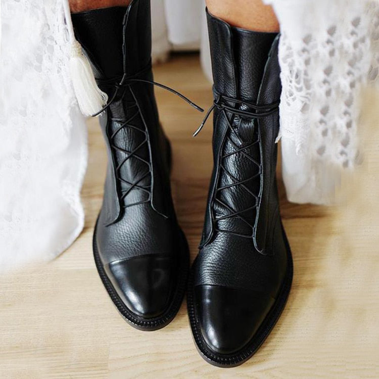 Elegant black leather high heel comfort boots for women, lace-up design, versatile fashion footwear.