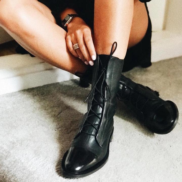 Pair of women's black high heel comfort boots, ready to wear, emphasizing elegant and versatile styling.