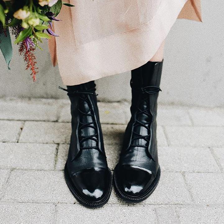 Side view of women's elegant high heel boots, showcasing comfort design and quality leather texture.