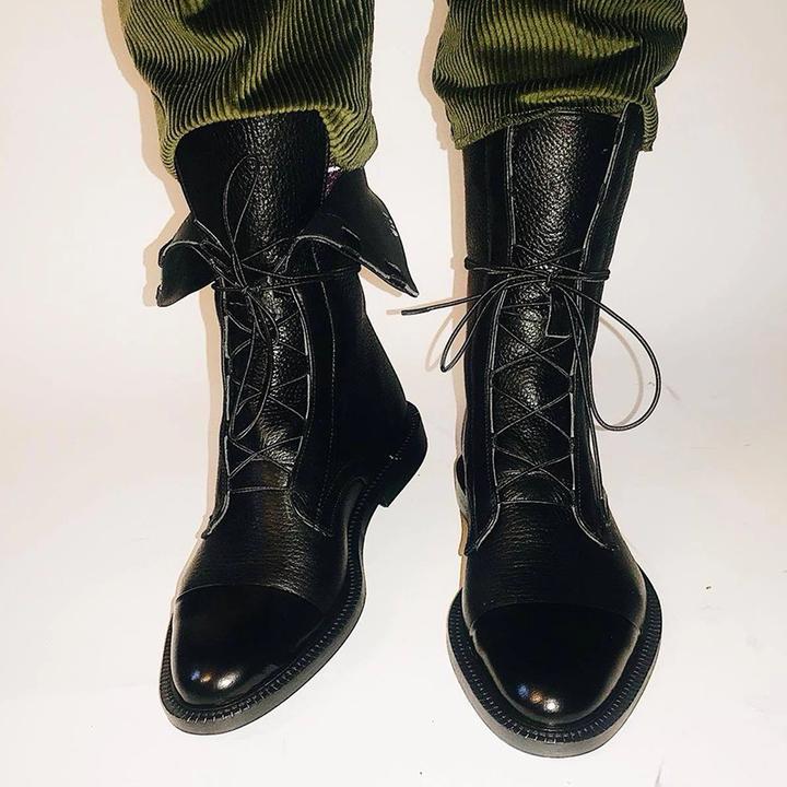 Lace-up front of women's premium leather boots, highlighting elegant design and comfortable fit.