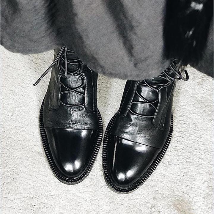 Stylish women's comfort boots featuring a high heel, crafted from supple black leather material.