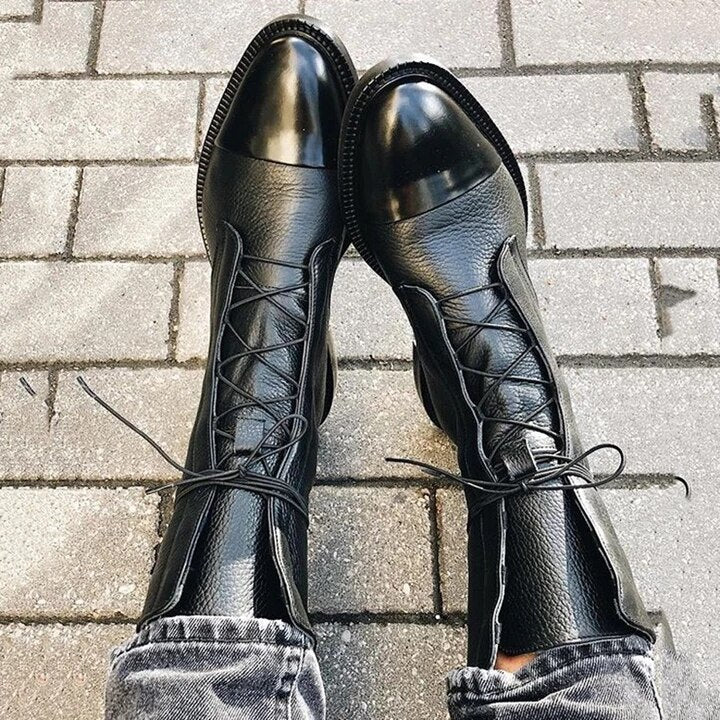 Detail shot of the sturdy high heel on women's elegant comfort boots, ensuring stability and style.