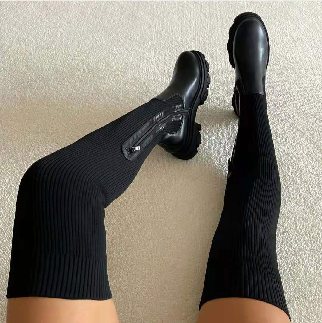 Elegant black leather knee-high boots for women, featuring a comfortable block heel and side zip closure.