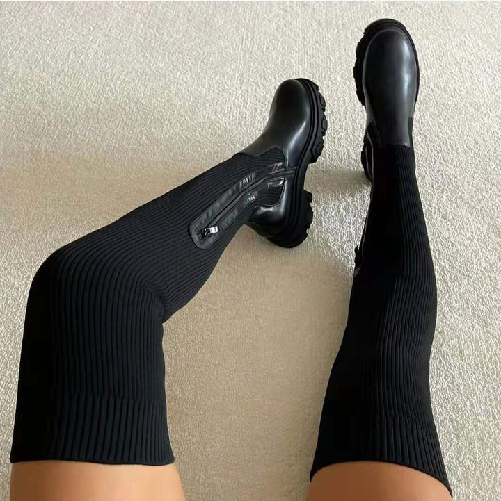 Elegant black leather knee-high boots for women, featuring a comfortable block heel and side zip closure.
