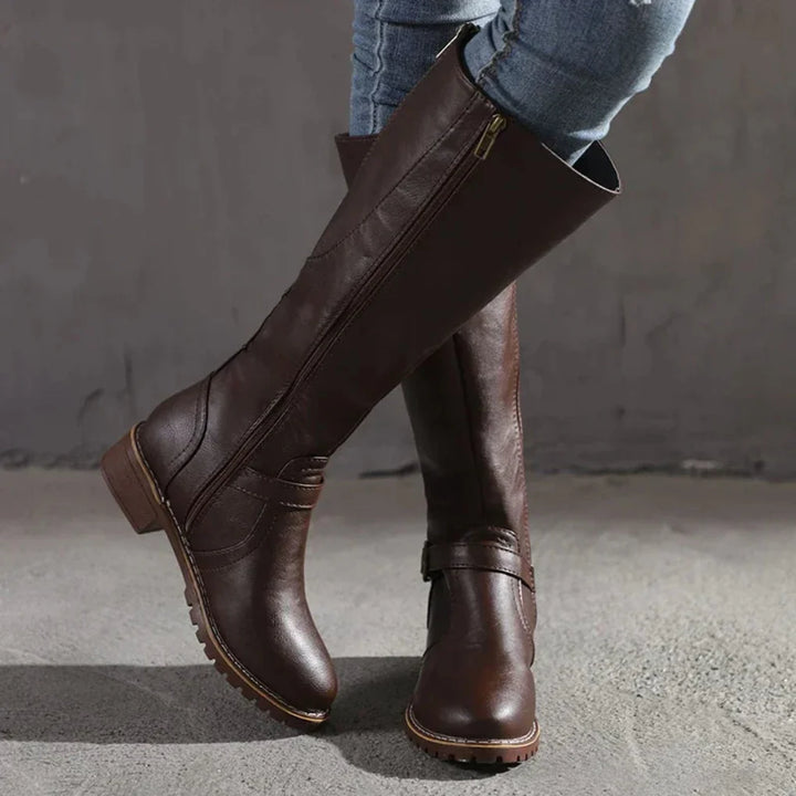 Women's sleek chestnut leather knee-high boots, ideal for adding an elegant touch to winter outfits