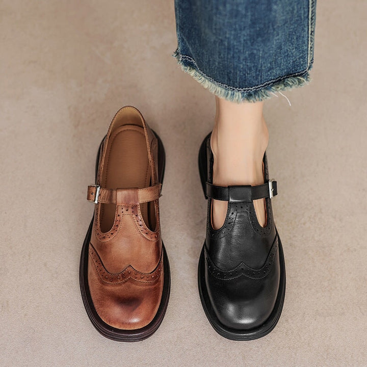 Women's fashion leather T-strap Mary Janes with brogue detail, a timeless and comfortable flat