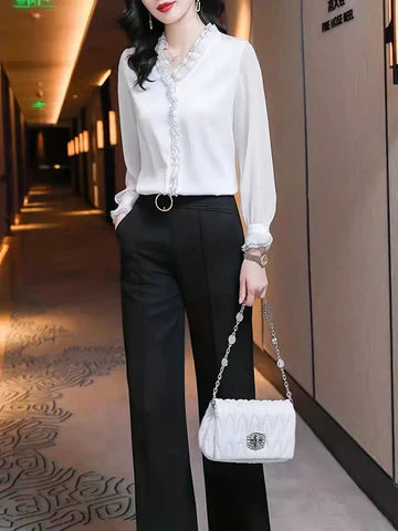 Casual yet chic white long sleeve ruffle blouse, a must-have for women's fashion.