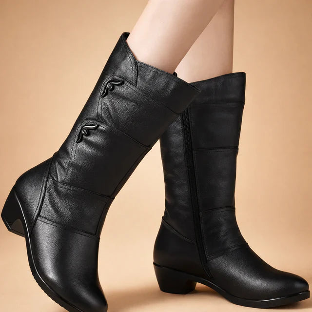 Versatile elegant mid-calf women's boots. Stylish black winter footwear offering comfort and cold weather protection.