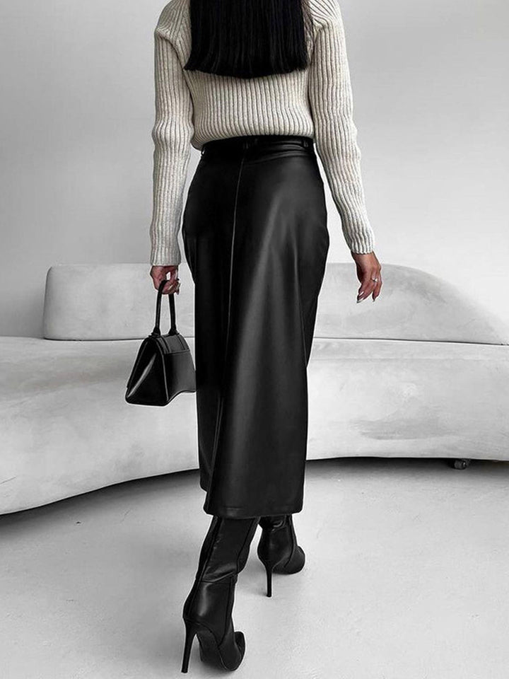 Versatile women's midi skirt in burgundy, showing a subtle slit, suitable for elegant and casual styles.