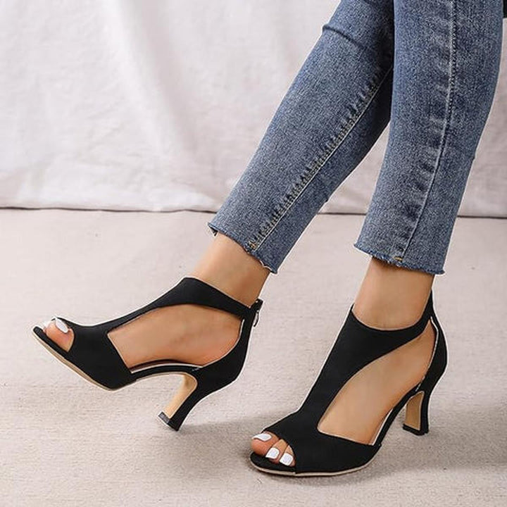 Elegant black open toe mid heel dressy shoes with cutout design, perfect for evening parties.