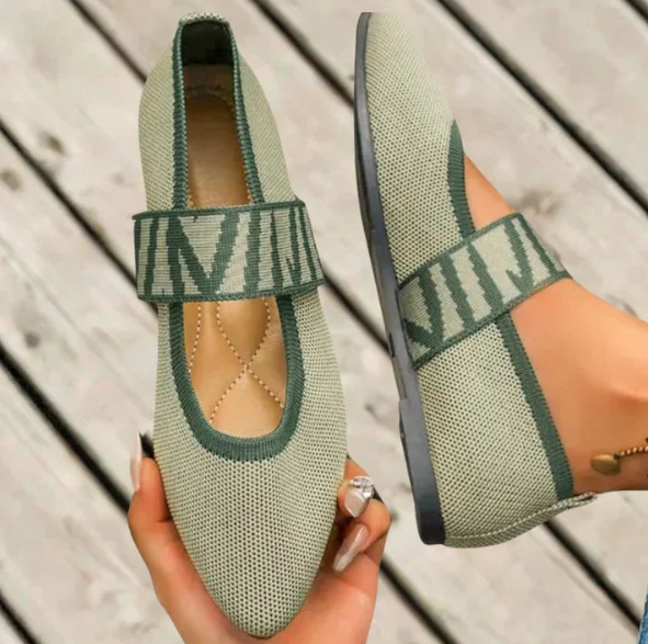 Classic white pointed toe ballet flats for women, offering comfortable and chic versatile footwear