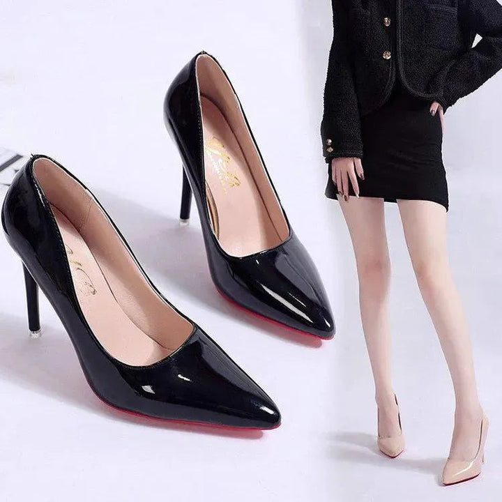 Elegant black stiletto pumps with low cut, high heel & round toe, for formal events or office wear.