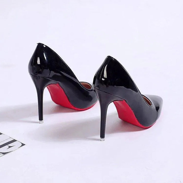 Elegant black stiletto high heel pumps for women, low cut, round toe, versatile for any formal setting.