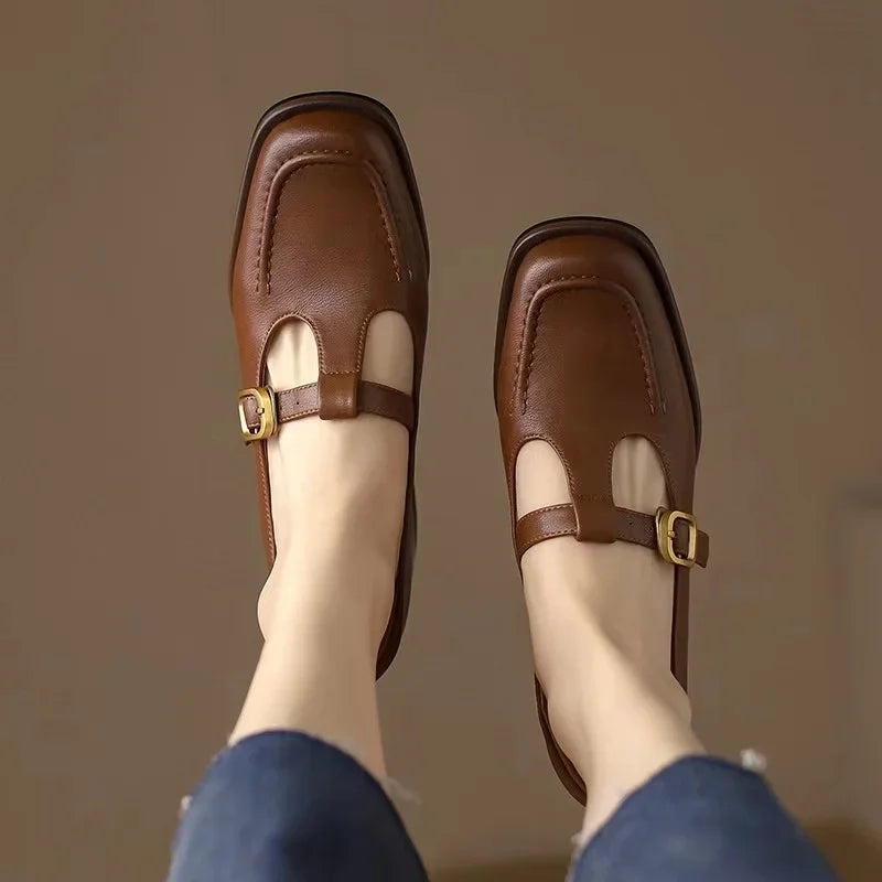 Close-up of the elegant T-strap detail on black block heel shoes for women
