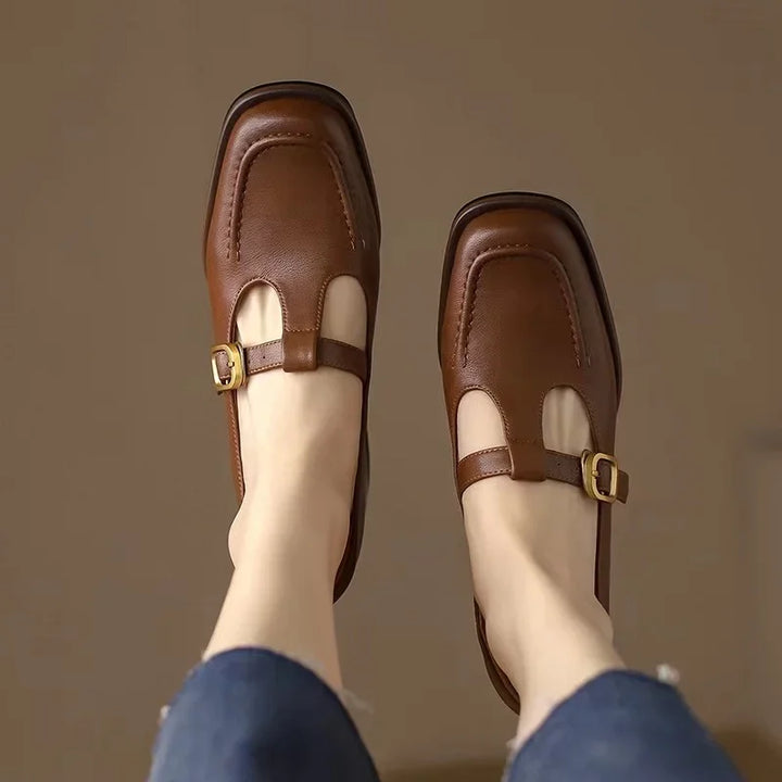 Close-up of the elegant T-strap detail on black block heel shoes for women