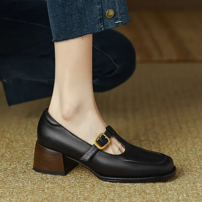 High-angle shot of women's T-strap block heel shoes, highlighting the strap and heel details