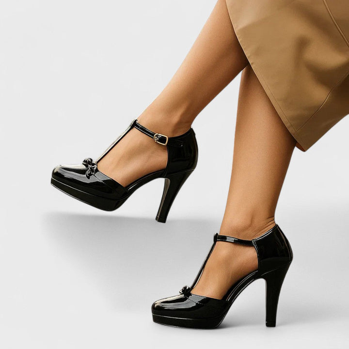 Women's luxurious gold T-strap bow platform heels, adding glamour to any formal outfit.