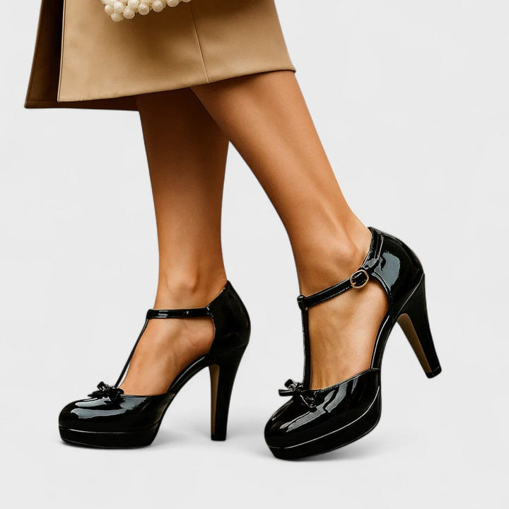 Stylish blue T-strap platform heels with a cute bow for women, great for summer fashion.