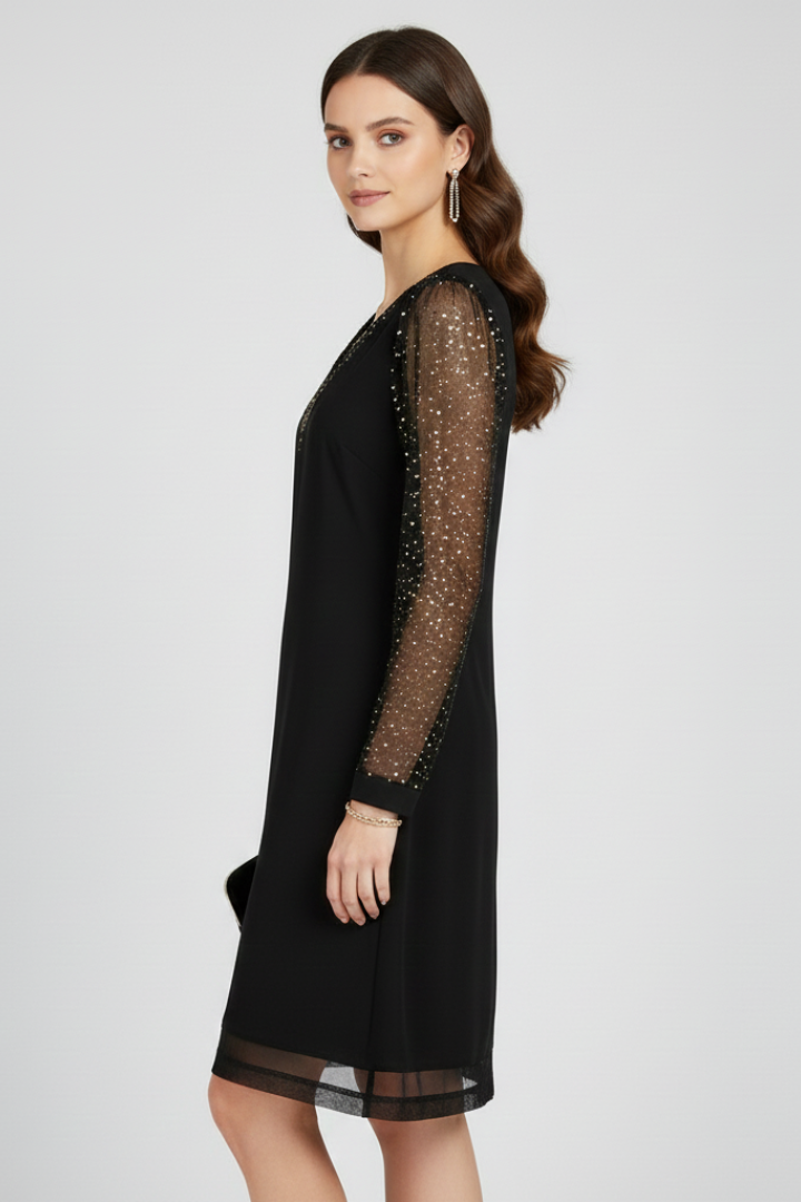 Close-up of a women's black evening dress, highlighting the shimmering sequin sleeves and elegant V-neck design