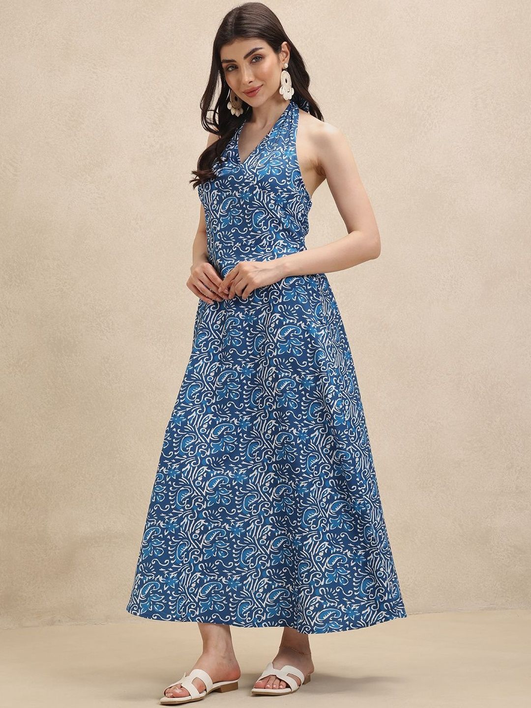 Elegant blue & white floral halterneck maxi dress for women. Perfect summer beach or party attire, flowing comfort.