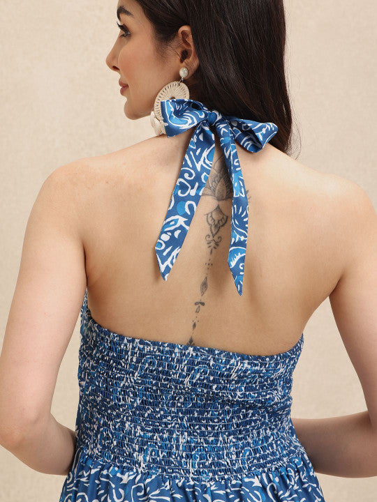 Flowing elegant blue & white floral halterneck maxi dress, ideal for women's summer vacation, beach, or casual party.
