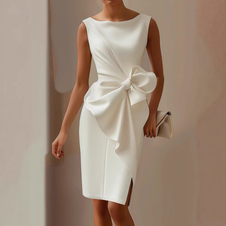 Graceful women's cocktail dress, sleeveless and adorned with an elegant draped bow.