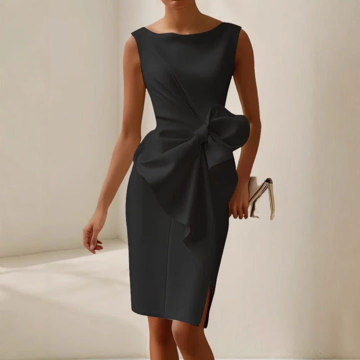 Formal women's cocktail dress with a sophisticated draped bow, suitable for evening events.