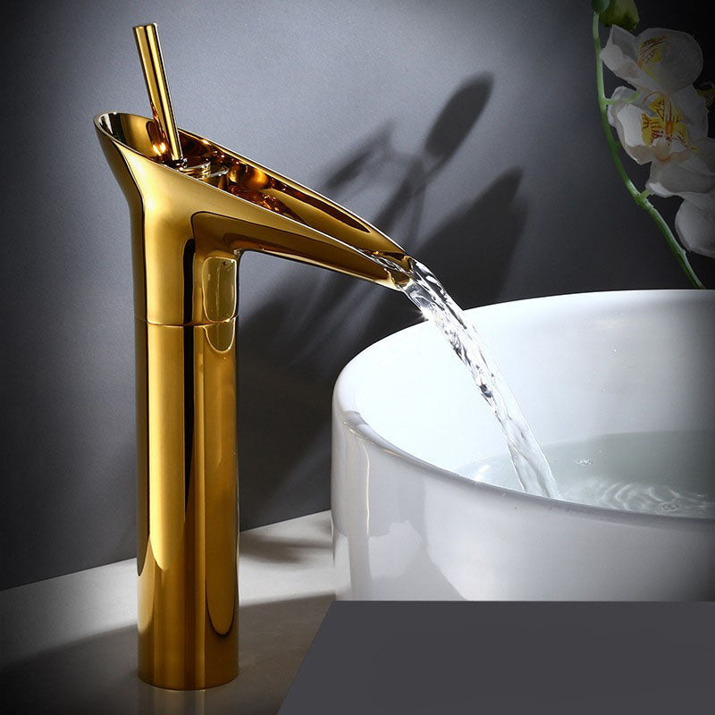 Polished chrome waterfall basin faucet. Sleek bathroom mixer tap for contemporary design.