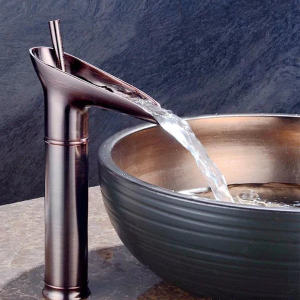 Chrome finish waterfall bathroom tap. Elegant mixer faucet for a clean, modern look.
