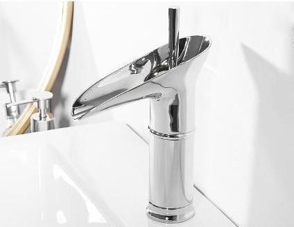 Luxury gold waterfall basin mixer tap. Sophisticated bathroom faucet for high-end decor.