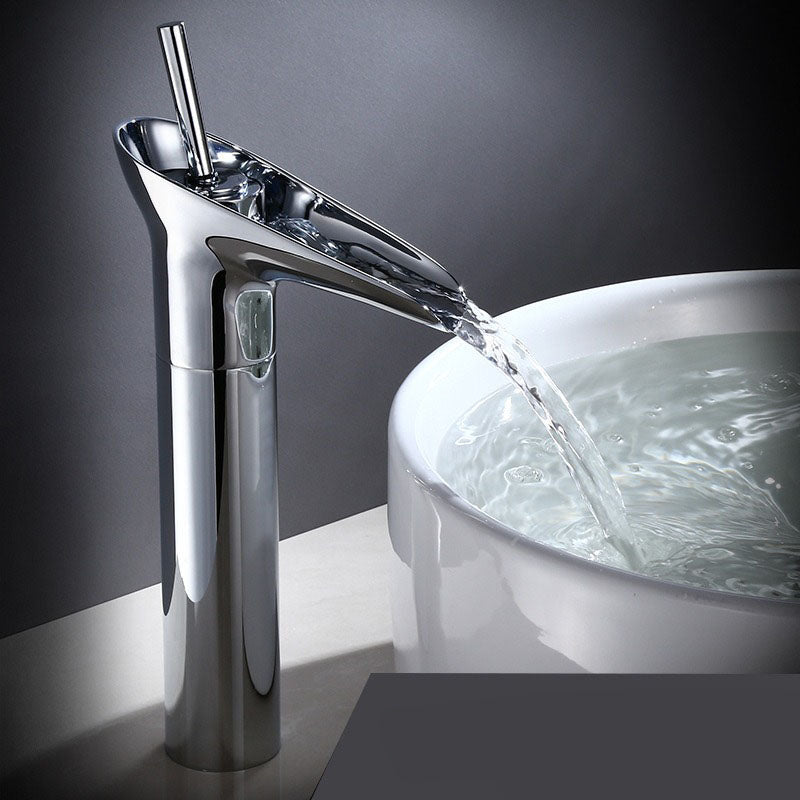 Brass waterfall faucet for bathroom. Elegant mixer tap with wide spout for gentle flow.