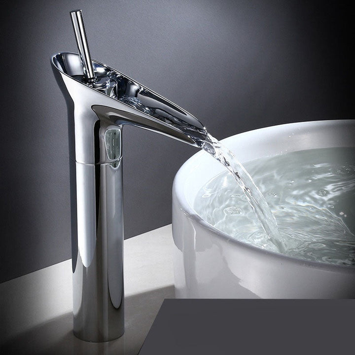Brass waterfall faucet for bathroom. Elegant mixer tap with wide spout for gentle flow.