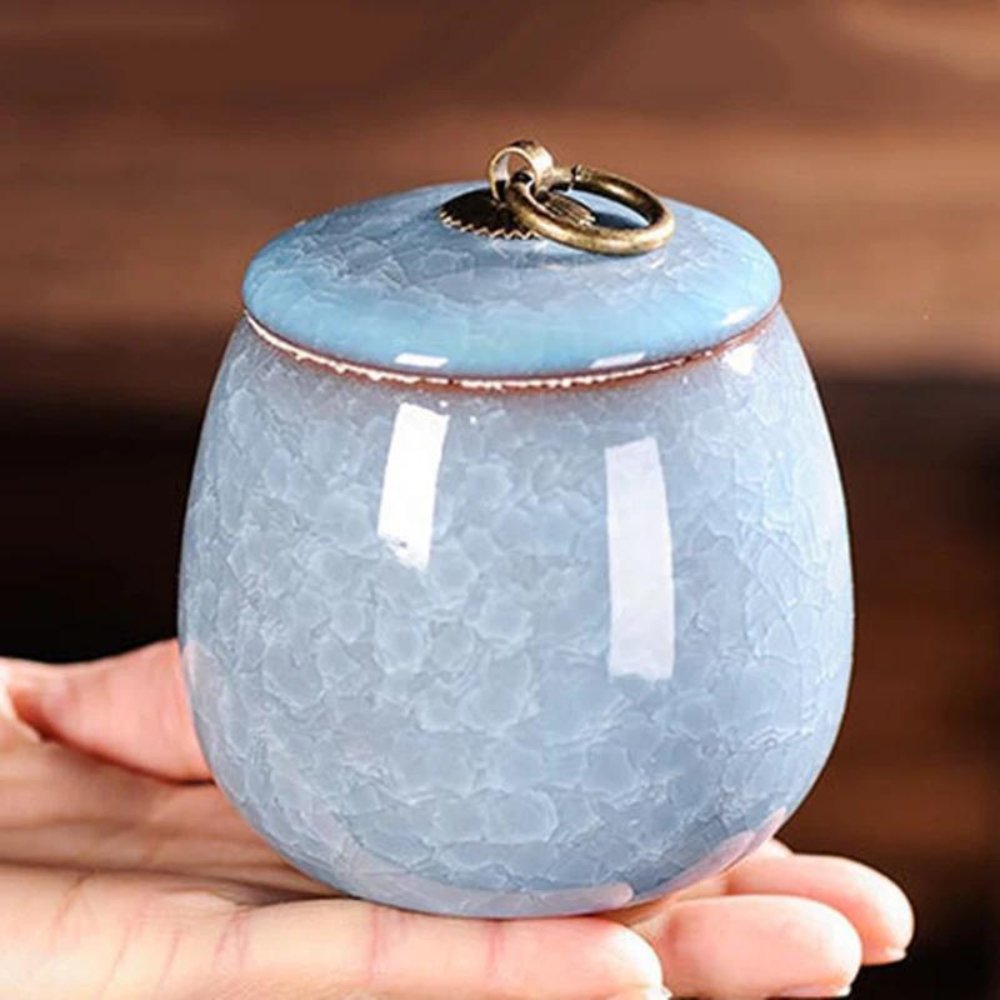 Elegant ceramic pet urn with craquelé glaze, a beautiful keepsake for beloved pet ashes.