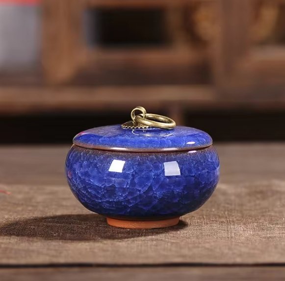 Beautiful ceramic pet urn with craquelé glaze, an elegant and comforting pet ashes memorial.