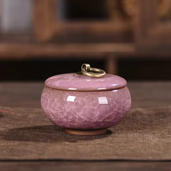 Handcrafted ceramic pet urn, craquelé glaze, a unique and respectful resting place for ashes.