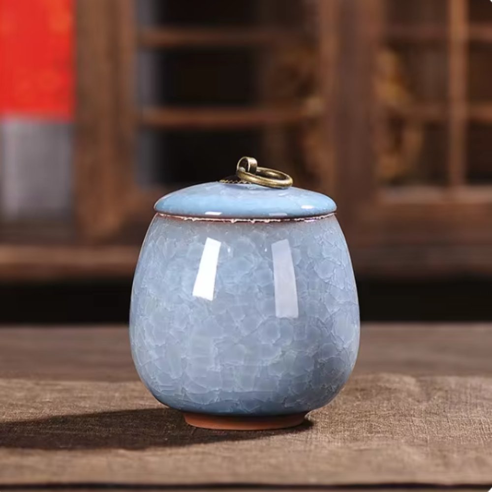 Dignified ceramic pet urn, craquelé glaze, a serene home memorial for cherished pet ashes.