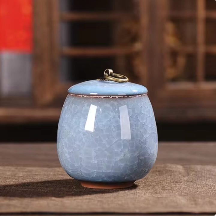 Dignified ceramic pet urn, craquelé glaze, a serene home memorial for cherished pet ashes.